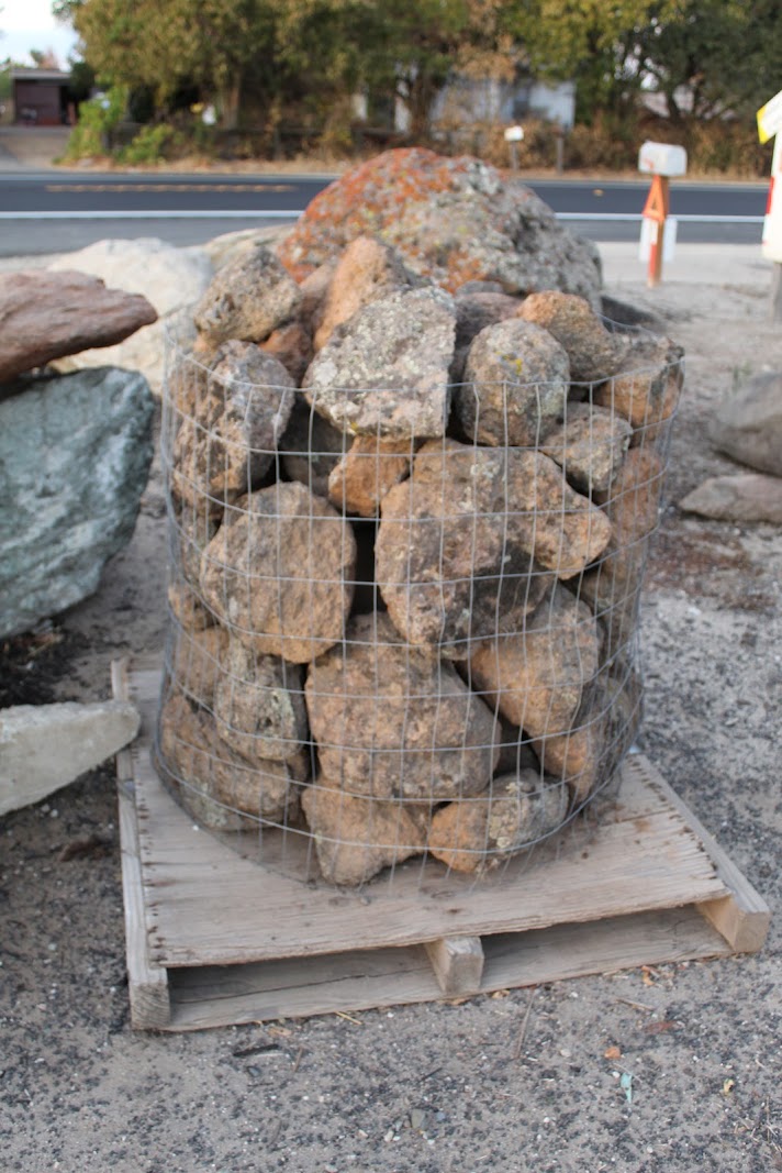 A wire crate of California moss rock harvested by We Buy Moss Rock, ready for shipment to a landscape buyer